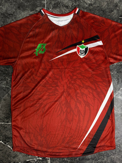 يشرت منتخب السودان الأحمر الأساسي 2025-2026 - طقم صقور الجديان الرسمي لمباريات تصفيات كأس العالم